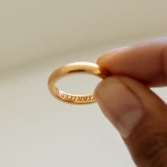 RHETA RING The simplicity and elegant crafted Personalized Name Medium Band Ring is the perfect symbol of love and devotion for your special day! Handmade 18k gold vermeil materials, with it's smooth gold accents and personalized engraved lettering. Give it your perfect tough by adding your name, initials, or even a special date. This ring is a sophisticated and meaningful gift to give to yourself, your beloved one, or another important person in your life.  -- If you would a thinner version, you can find our Rhia Thin Band Ring below https://etsy.me/3P7JVXB -- If you would a bold version, you can find our Reina Thin Band Ring below *MATERIAL:  -- 100% Recycled Sterling Silver - This solid, precious metal is a classic that lasts forever. While it may darken over time, with continuous care Timeless Stackable Engraved Ring For Anniversary, Simple Round Band Midi Rings For Anniversary, Classic Gold Midi Rings For Promise, Simple Midi Rings For Anniversary, Minimalist Initial Ring With Engraving Option For Wedding, Minimalist Jewelry With Hallmarks For Anniversary, Classic Engraved Promise Ring With Hallmarks, Minimalist Wedding Initial Ring With Engraving Option, Timeless Stackable Rings As Gift