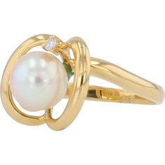 Experience the allure of timeless elegance with this exquisite 18K Yellow Gold Pearl Ring. At the heart of this masterpiece lies a luminous 7mm pearl, perfectly spherical and glowing with a rich, iridescent sheen that captures the light with every movement. The pearl is gracefully embraced by a contemporary swirl of 18K yellow gold, creating a harmonious blend of classic and modern aesthetics.Accentuating the pearl's natural beauty is a delicate diamond, weighing 0.015 carats, set seamlessly into the gold swirl. This sparkling gem adds just the right touch of brilliance, elevating the ring's sophistication. The design is both captivating and refined, making it a perfect choice for special occasions or as a cherished everyday piece.This ring is more than just jewelry; it is a symbol of love Gold Anniversary Rings, Sophisticated Jewelry, Gold Pearl Ring, Pearl And Diamond Ring, Diamond Birthstone, Birthday Ring, Yellow Gold Jewelry, Luxury Rings, 18k Yellow Gold Ring