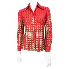 1970s Lanvin red printed shirt with turning tile motif. Accented with butterfly collar, cuffed sleeves, and red buttons. This item is made of a fine knitted polyester. Designer Fitted Red Shirt, Designer Red Fitted Shirt, Designer Red Long Sleeve Shirt, Red Fitted Printed Shirt, Fitted Printed Red Shirt, Fitted Red Printed Shirt, Retro Red Formal Tops, Red Retro Formal Tops, Red Collared Top With Retro Print