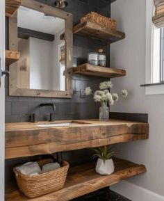 a bathroom with wooden shelves and a sink