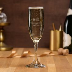 a wine glass sitting on top of a wooden table