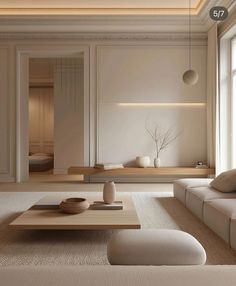 a living room filled with lots of white furniture