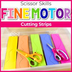 scissors are sitting on top of colorful paper strips with the words fine motor cutting strips