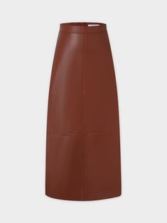 The Leather A-Line Skirt-Cognac is a versatile addition to any wardrobe. The A-line silhouette flatters all body types while the cognac color and leather-like material add a touch of sophistication. Brown Leather Flared Skirt, Classic Leather Skirt For Fall, Formal Brown Leather Skirt, Formal Leather Brown Bottoms, Formal Brown Leather Bottoms, Formal Brown Flared Skirt, Chic Brown A-line Skirt, Elegant Brown Leather Skirt, Relaxed Fit Long Leather Skirt