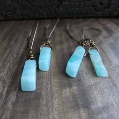 Like waters deep and ancient, Amazonite beckons in captivating shades of turquoise-green, promising to soothe the spirit and calm the soul. Its energy is as powerful as the river for which it is named, and as bold as the legendary women warriors with whom it is connected. Harness your inner goddess in a pair of these today! ★ Hand selected all natural raw amazonite gemstones ★ Ready to ship in 1-2 days ★ Crystals range 20-25mm long ★ These hang approx. 2.5" ★ Aged brass kidney ear wires ★ Crysta Raw Amazonite, Raw Crystal Earrings, Amazonite Earrings, Women Warriors, Raw Stone Earring, Metaphysical Jewelry, Hardware Jewelry, Boho Crystal, Stone Dangle Earrings