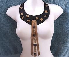 A unique tribal choker to complete your boho style outfit ! *DESIGN* A black genuine  leather choker with tan leather fringe  and  beaded chain. 2 leather ties at the ends for an adjustable fit. *SIZE* free neck size  10 inch length from the middle front  ..   26 cm ** international shipping at letter rate, with no tracking. Upgrades available at checkout. earthy Boho style Thanks for looking, Kathy Leather And Beads, Men Choker, Festival Jewellery, Beads Choker, Boho Outfit, Boho Style Outfits, Bohemian Festival, Boho Choker, Fringe Necklace