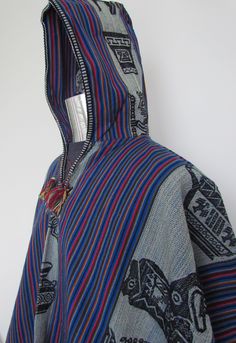 "This is a beautiful and bright Blue wool-blend Shaman's Poncho with traditional Andean symbols and accents. This poncho is handwoven in the Sacred Valley of the Incas, the Andes of Peru in South America. Made in Peru Standard size: Size: 35\" L x 51\" W" Casual Blue Cotton Poncho, Blue Long Sleeve Poncho For Festivals, Bohemian Long Sleeve Blue Poncho, Blue Long Sleeve Festival Poncho, Peruvian Poncho, Sacred Valley, Hooded Poncho, Blue Wool, Striped Pants