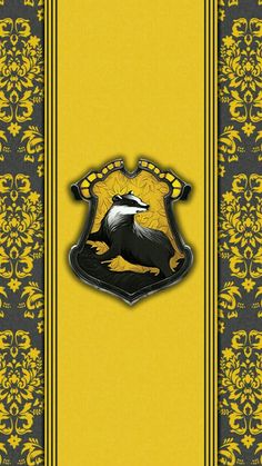 an image of a yellow and black wallpaper with a coat of arms on it