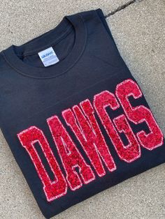 These DAWGS sweatshirts are super comfy as well as the perfect touch with boots and jeans!  We can create tees, sweatshirts and long sleeve tees with your team colors! Message us today to order! ❗️Sizes: Adult S-XL  Adult 2X- Adult 3X Tees and Sweatshirts are unisex sizing!   The sweatshirt has DAWGS stitched onto the sweatshirt in red real sequins! If you would prefer a red sweatshirt with black sequins, please leave a note in the personalization section! If you would like to request a custom o Georgia Sweatshirt, Bulldogs Shirt, Georgia Bulldogs Shirt, Georgia Shirt, Boots And Jeans, Georgia Dawgs, Mascot Shirt, Sports Sweatshirt, Bulldog Shirt