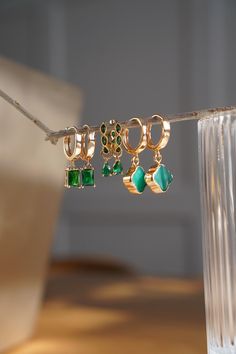 Elegant Green Emerald Dangling Zircon Hoop Earrings 18K Gold Plated Nickel Free Hypoallergenic Dangling Earrings Delicate and elegant in style. Great for gifting. Perfect for special occasions or everyday wear. Pair these earrings with our emerald gold necklace  https://www.etsy.com/ca/listing/1663196784/emerald-green-gold-necklace-may?click_key=8aa688bbc06523bdb0927672b4ea194b891f2305%3A1663196784&click_sum=b2c9238f&ref=shop_home_active_2&pro=1&frs=1 EARRING DETAILS Hoop diameter: 16mm Zircon H Elegant Green Dangle Huggie Earrings, Hypoallergenic Gold Plated Green Jewelry, Hypoallergenic Green Gold-plated Jewelry, Green Dangle Hoop Earrings, Green Hoop Earrings For Wedding, Green Drop Huggie Earrings, Gold Emerald Huggie Earrings Gift, Green Hoop Gold-plated Jewelry, Green Hoop Jewelry For Weddings