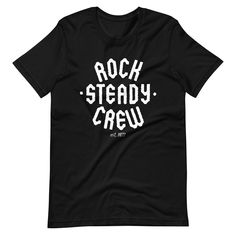 Introducing the Rock Steady Crew T-Shirt, the ultimate addition to any hip-hop enthusiast's wardrobe! Made with high-quality materials and designed with the iconic Rock Steady Crew name, this t-shirt is the perfect way to show off your love for the legendary b-boy crew. Crafted from soft and breathable cotton, the Rock Steady Crew T-Shirt is comfortable to wear and allows for easy movement, making it perfect for dancing, performing, or just hanging out. The shirt is available in a range of sizes Rock And Roll Cotton T-shirt With Graphic Print, Relaxed Fit T-shirt With Text Print For Music Festivals, Hip Hop Graphic T-shirt For Concerts, Band Merch Crew T-shirt For Fan Merchandise, Relaxed Fit T-shirt For Music Festivals Fan Merchandise, Crew Neck T-shirt With Text Print For Concert, Hip Hop Crew Neck T-shirt Fan Merchandise, Hip Hop Style T-shirt With Letter Print For Fans, Hip Hop Crew Neck T-shirt For Fan Merchandise