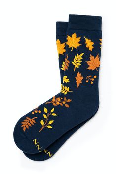 These high-quality socks are made with soft, breathable cotton and feature a beautiful fall-themed design with colorful leaves. The cozy design is perfect for the cool weather of the season, and the comfortable material will keep your feet warm and cozy. These socks are durable and suitable for everyday wear, making them a great addition to your fall wardrobe. The colorful leaf design adds a touch of nature to your outfit, so you can embrace the beauty of the season in style. Casual Blue Socks For Fall, Casual Socks As Gift For Fall, Casual Socks For Fall, Casual Fall Blue Socks, Casual Socks As A Gift For Fall, Comfortable Cotton Socks For Fall, Casual Socks For Fall Gift, Comfortable Fall Socks, Trendy Fall Socks