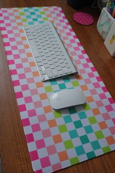 a mouse pad with a computer keyboard on it