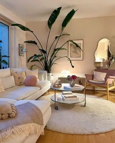 a living room filled with furniture and a large window