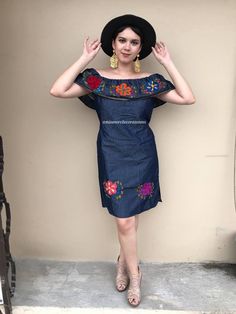 "Really modern Mexican dress, hand-embridered. Off shoulder. Fabric: Denim Loose fit Fits size Small Measurements taken flat: Armpit to armpit 21 1/2\" Width 22\" Length 34\"" Off-shoulder Embroidered Spring Dress, Floral Embroidered Off-shoulder Dress, Fitted Off-shoulder Festival Dress, Off-shoulder Fitted Festival Dress, Traditional Fitted Dress For Cinco De Mayo, Embroidered Fitted Denim Dress, Fiesta Floral Embroidery Dress, Bohemian Denim Dress With Floral Embroidery, Folk Style Cotton Fiesta Dress