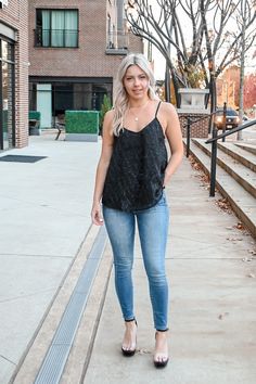 Our Textured tank top features sparkly and black detail on the front with adjustable straps! So cute to wear this holiday season! 100% Polyester Model is wearing a Small True to size! *For more info on model measurements checkout our model sizes page!* MADE BY: KORI Black Cami Top For Fall, Casual Tank Strap Tops For Night Out, Trendy Fall Cami Tank Top, Casual Tops With Tank Straps For Night Out, Casual Tank Straps Camisole For Night Out, Trendy Tank Top For Night Out In Fall, Trendy Cami Tank Top For Night Out, Fall Black Cami Top, Casual Tank Top With Tank Straps For Party