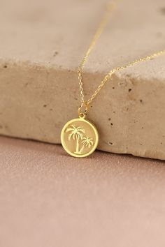 Gold Palm Tree Pendant - Beach Necklace Gold Necklace ● Material of pendant: Solid Gold 14k ( REAL GOLD ) ● Metal Stamp: 14k ( REAL GOLD ) ● The pendant is available in 5 sizes: - 12,7 mm / 0.5 inches (Diameter) - 14,0 mm / 0,55 inches ( Diameter ) In the photos - 15,3 mm / 0.6 inches ( Diameter ) - 16,5 mm / 0,65 inches ( Diameter ) - 19,1 mm / 0,75 inches ( Diameter ) ( In the photos the size is 14mm / 0.55 inches Diameter ) ( Jump Ring inner diameter: 4 mm ) ● Material of chain: Solid gold 14 Affordable Symbolic Good Luck Necklace, Florida Jewelry, Egyptian Gold, Palm Tree Necklace, Palm Tree Pendant, Tropical Jewelry, Sunflower Pendant, Beach Necklaces, Tutankhamun