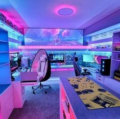 a room with purple and blue lighting in the ceiling is filled with computer desks