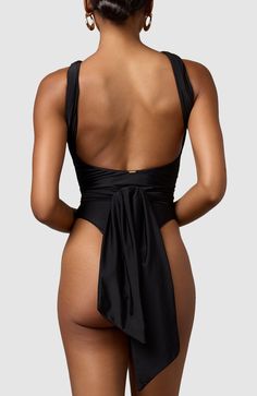 Imagine having a single swimsuit that you can pack for every vacation without worrying that you've already taken photos in it. You can wear this multiway, infinity-style swimsuit over and over and serve a different look every time. Infinite ways to wear Thick double-lined fabric High cut at legs Very cheeky bottoms Black Halter Neck Swimwear With Tie Back, Black Tie Back Halter Neck Swimwear, Black Tie-back Swimwear For Summer, Vacation Nylon Backless Bodysuit, Party Swimwear With Tie Back Triangle Top, Elegant Black Swimwear For Vacation, Sleeveless Nylon Swimwear With Tie Back, Chic Nylon Backless Swimwear, Black Tie-back Swimwear For Sunbathing