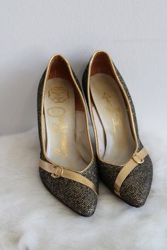 This is a vintage pair of high heel shoes. They are a deep gold/bronze tone in a metallic pattern. They also have a gold/bronze tone detail along the toe. The shoes are in good condition.Size: 5.5 NarrowInside Length: 9" | Inside Width: 3" | Outside Heel Length: 3.5" | Inside Heel Length: 2.5"Unless otherwise stated all vintage items are used and may have minor to moderate wear or discoloration considering the age of the item. Most items have been hand washed, spot cleaned, or professionally dry Gold High Heel Court Shoes With 4-inch Heel, Gold Court Shoes With 4-inch Heel For Evening, Gold Court Shoes With 4-inch Heel And Almond Toe, Gold Closed Toe Heels With Metal Feet, Gold Heels With Metal Feet For Evening, Gold Heels With Metallic Accents For Party, Gold Pointed Toe Heels For Formal Occasions, Gold Low Heel Formal Heels, Chic Gold Low Heel Court Shoes