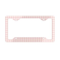 a pink and white checkered license plate frame with an oval hole in the center