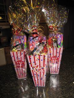 three boxes filled with candy sitting on top of a counter