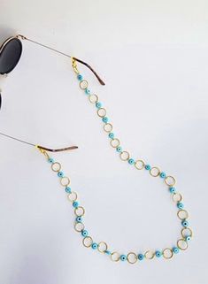 sunglass chain, Sunglass Holder, evil eye glasses chain, eyeglass chain, sunglass strap, sunglass strap, beaded strap, sunglass cord, boho Handmade eyeglass holder.  The strap is 28 inches long, if you pretend another size please let me know :)  Handmade with love :) Trendy Metal Glasses Chains For Summer, Trendy Metal Glasses Chains For The Beach, Trendy Metal Glasses Chains For Beach, Silver Glasses Chains For Summer Beach, Silver Glasses Chains For Beach In Summer, Summer Beach Silver Glasses Chains, Summer Glass Necklace With Adjustable Chain, Gold Glasses Chains For Beach And Summer, Gold Glasses Chains For Summer Beach