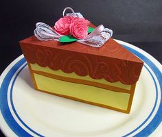 a piece of cake sitting on top of a blue and white plate next to a black background