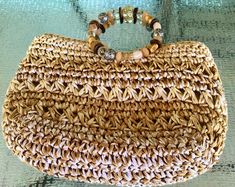 Beach Look Handbag-Rafia Straw Knotted Purse-Bejeweled Handle Straw Handbag-Ladies Straw Day to Evening Bag-FREE SHIPPING Day to Evening Bag Bohemian Chic. Straw woven Purse with faux bejeweled Handles Handles made from stylish plastic Beads Fully lined with pockets and zipper closure to keep items safe and secure. In very good condition clean inside. Thanks for shopping with us. Denise ♥️ Spring Bohemian Beaded Bags, Spring Beach Bags With Beaded Details, Bohemian Beaded Bags For Vacation, Bohemian Beaded Shoulder Bag For Beach, Summer Bohemian Beaded Shoulder Bag, Bohemian Beaded Shoulder Bag For The Beach, Bohemian Beaded Shoulder Bag For Summer, Spring Beach Beaded Bags, Summer Beach Beaded Straw Bag