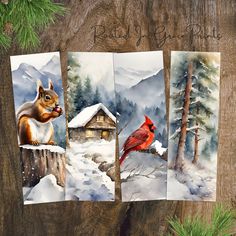 three cards with pictures of animals and birds in the snow, one has a red bird on it