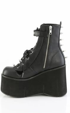 The Kera series features an impressive platform wedge across a range of styles to suit everyone who wants to tower over the competition. Vegan Black PU leather 4 1/2" Inch (114mm) Platform Lace-Up Front Ankle Boot Featuring Top Skull Buckle Strap & Metal Spike Stud Details Inner Side Metal Zip Closure U.S women's sizing-refer to size chart for more info Punk Style Platform Boots In Synthetic Material, Punk High Ankle Platform Boots In Synthetic, Punk High-top Platform Boots In Synthetic Material, Edgy High Ankle Platform Boots In Synthetic, Punk High-top Synthetic Platform Boots, Edgy Leather Platform Boots With Thick Sole, Edgy Leather Platform Boots With Thick Bottom, Edgy Synthetic Platform Boots With Chunky Platform, Edgy High-top Synthetic Platform Boots