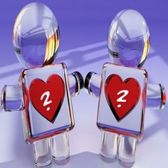 two glass figurines with question marks on their backs, one is red and the other is clear