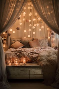 a bed with lots of lights hanging from it's sides and pillows on top