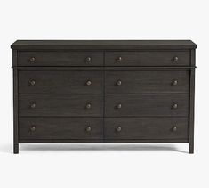 a black dresser with several drawers and knobs on the bottom drawer, in front of a white background