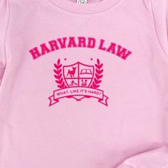 Introducing our limited edition pink tshirt, inspired by the iconic movie "Legally Blonde." This item features a bold "Harvard Law… What, Like It's Hard?" slogan in eye-catching pink ink. Channel your inner Elle Woods and showcase your wit and style with this must-have fashion statement. Embrace the empowering spirit of the film while staying cozy and fashionable in this exclusive tshirt. Legally Blonde Merch, Legally Blonde Harvard, What Like Its Hard, Legally Blonde Outfits, Harvard Logo, Blonde Shirt, Harvard Law