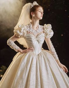 a woman wearing a wedding dress with long sleeves