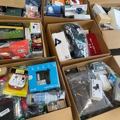 several boxes filled with different types of electronic devices