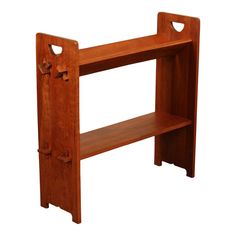 a wooden shelf with two open doors on the top and bottom, against a white background