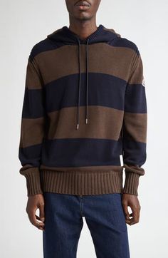 Knit from chunky cotton in an oversized fit, this boldly striped hoodie serves classic Moncler style with an archival logo patch at the hem. 28" length (size Medium) Drawstring hood Ribbed cuffs and hem 100% cotton Hand wash, dry flat Imported Designer Clothing Casual Winter Sweatshirt With Striped Cuffs, Casual Striped Hoodie With Ribbed Cuffs, Striped Sweatshirt With Drawstring Hood For Winter, Striped Hoodie With Ribbed Cuffs For Winter, Winter Striped Hoodie With Ribbed Cuffs, Logo Knit, Striped Hoodie, Cotton Hoodie, Knit Cotton