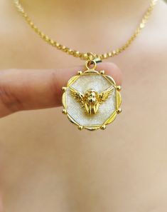 "✨ Gold plated angel pendant necklace (cherubim necklace) for women will make a perfect gift for your girlfriend, any woman, and even yourself. ♥️ The necklace contains an angel shape, melted nacre (white area), and a small evil eye (which can be detached easily on demand). ✨ It is made of 24K gold plated metal. ♥️ The materials used are first quality. ✨ The chain length is fully adjustable as your wish. ✨The chain is also plated with rhodium, making it shinier and resistant to oxidation and tarnish. ♥️ 100% satisfaction guarantee; Return it within 14 days if you feel unsatisfied. ✨ Please don't hesitate to get in touch with me with any questions. SPECIFICATIONS -- Materials: 24K gold plated metal -- Necklace Length: approx. 70 cm/27\" long and fully adjustable -- Total Weight: approx. 15 White Plated Necklaces As Gift, Angelic Gold Necklaces As Gifts, Angelic Gold Necklaces For Gifts, Angelic Gold Necklace For Gift, Angelic Gold Pendant Necklace, Angelic Gold Pendant Jewelry, Angelic White Jewelry For Gifts, Angel Pendant Necklace, Angel Pendant