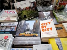 many books are stacked on top of each other in the shape of a taxi cab