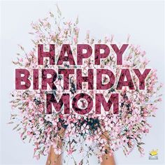 the words happy birthday mom are surrounded by pink and white flowers in front of two women's hands