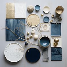 various plates and bowls are arranged on a table