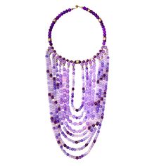 The choker measures 16 IN, and the longest strand of beads measures 30 IN.   The necklace design displays dangling glass beads in shades of purple with brass accent beads—the beads lay in the front of the chest without moving out of place. Glass Beads Necklace, Out Of Place, Necklace Design, Brass Accents, Moving Out, Glass Bead Necklace, Beads Necklace, Shades Of Purple, Necklace Designs