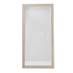 a white and gold framed mirror on a white wall with an empty space in the middle