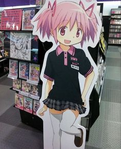 a cardboard cutout of a girl in a school uniform is on display at a store