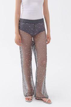 These high waisted mesh pants with an elastic waistband and glitter thread offer a fashionable and flattering design, perfect for enduring your busy lifestyle from day to dinner. Dry clean Material: 100% Polyester High rise Officially licensed Imported Brand: Nocturne Model Product Size: S Model Size: Height 5'10 / Bust 29.5 in / Waist 23 in / Hips 34 in True the size Summer Evening Bottoms With Elastic Waistband, Sheer High Waist Bottoms For Evening, Summer Evening Pants With Elastic Waistband, Party Bottoms With Elastic Waistband, Glamorous Evening Bottoms For Summer, Glamorous Evening Summer Bottoms, Glamorous Summer Evening Bottoms, Evening Mesh Bottoms With Stretch, Evening Stretch Mesh Bottoms