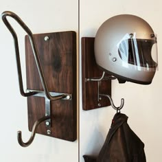 a helmet mounted to the side of a wall next to a coat rack with hooks