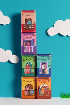 four children's books stacked on top of each other with clouds in the background