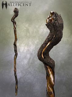 an artistic piece of art that looks like a twisted tree branch with gold paint on it